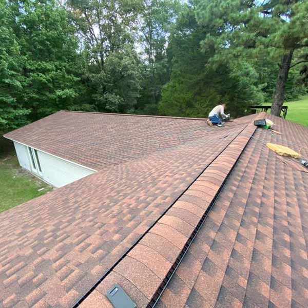 Angelo Roofing LLC team member working on a roof